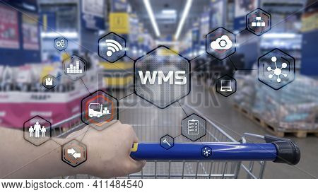 Inscription Wms On Blurred Warehouse Background. Werehouse Management System