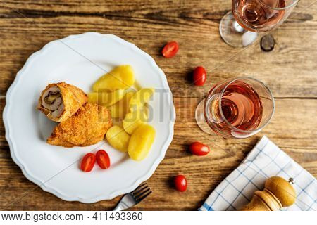 Traditional French Cuisine Chicken Roll Cordon Bleu Or Gordon Blue With Cheese, Ham And Potatoes