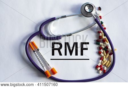 Notebook Pade With Acronym Rmf On A Table With A Stethoscope And Pills. Medical Concept