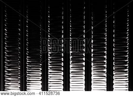 Abstract Image Of A Coil Of An Automobile Radiator Of A Cooling System In The Backlight. The Structu