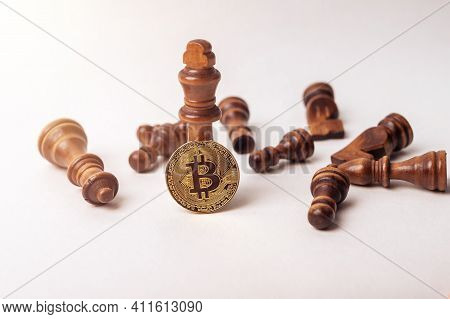 Bitcoin Coin Near King And Fallen Chess Figures Oon White Background