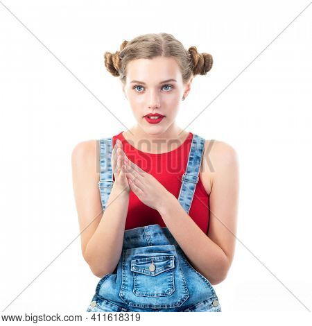 lBeautiful woman wearing red top and blue jeans posing at studio with worry, waiting, interest, concern human emotions, portrait over white background. 