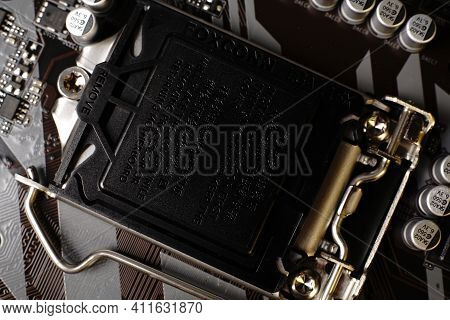 Moscow, Russia - March 3 2021: Macrophotograph Of A Modern Branded Motherboard Pc. Dimmed Lights