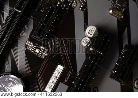 Moscow, Russia - March 3 2021: Macrophotograph Of A Modern Branded Motherboard Pc. Dimmed Lights