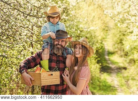 Hobby Brings Them Joy. Happy Family In Spring Garden. Family Hobby. Bearded Man And Woman With Child