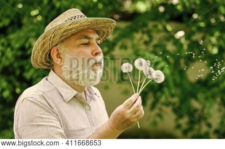 Tranquility And Serenity. Harmony Of Soul. Elderly Man In Straw Summer Hat. Happy And Carefree Retir