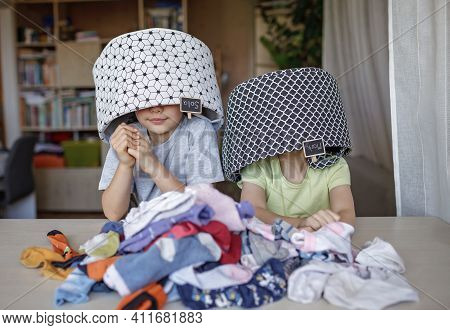 Household Chores For Children. Kids Cleaning Their Room, Sorting Dry Socks And Arranging Them Into P