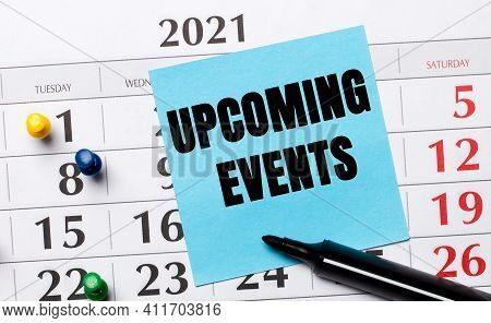 The Calendar Has A Blue Sticker With The Text Upcoming Events And A Black Marker. Organizational Con