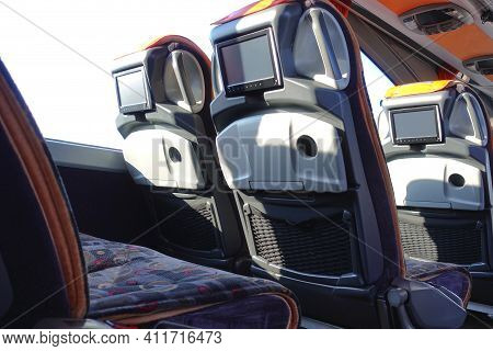 Intercity Bus Interior With Seats And Monitors.