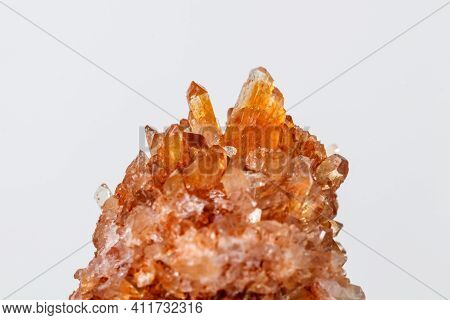 Macro Of Mineral Stone Creedite On Microcline On White Background