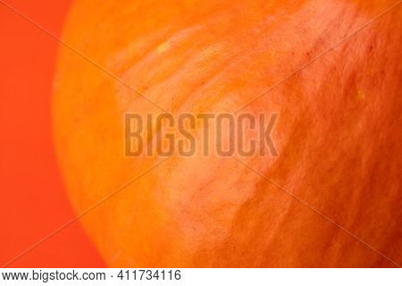 Teksture Of Orange Pumpkin On The Orange Background