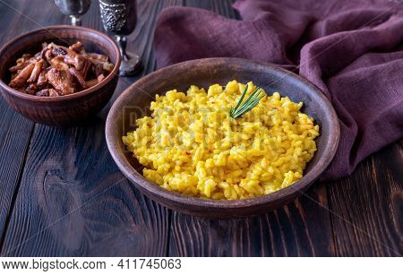 Portion Of Saffron Risotto With Fried Chanterelles