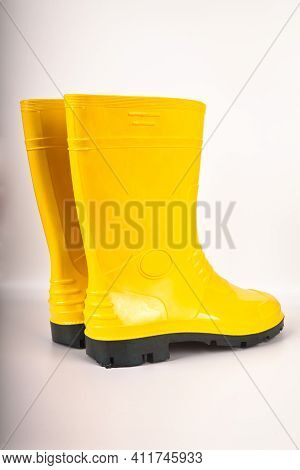 Robust And Waterproof Yellow Rubber Boots Isolated On White Background