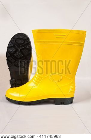Robust And Waterproof Yellow Rubber Boots Isolated On White Background