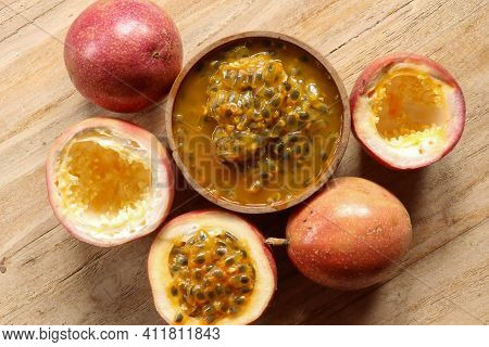 Fresh Passion Fruit In Wood Bowl On Wood Table In Top View Flat Lay With Copy Space For Background O