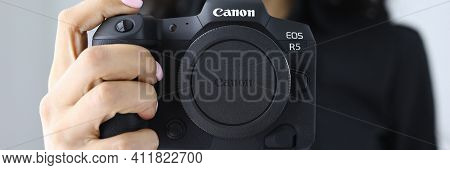 Minsk, Belarus - November 19 2020 : Woman Hold Canon Eos R5 In Hand Closeup. Illustrative Editorial.