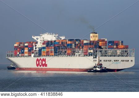 Antwerp, Belgium - Mar 12, 2016: Container Ship Oocl Singapore Leaving A Container Terminal In The P
