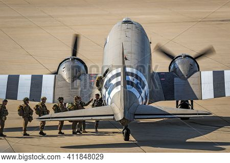 Paratroopers Entering A Douglas C-47 Skytrain Dakota Plane For A Jump At The Market Garden Memorial.