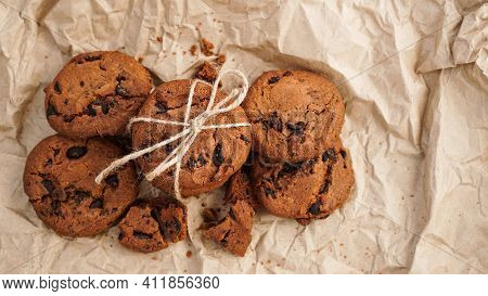 Flatview Of Handcrafted Chocolate Cookies With Chocolate Chips On Baking Paper
