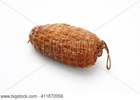 Small, Natural, Smoked Ham In One Piece, In Netting, Isolated On A White Background. Homemade, Smoke