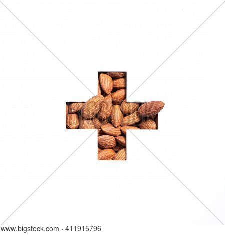 Plus Summation Sign Or Cross Of Nuts Almonds And Cut Paper Isolated On White. Typeface For Ecofriend