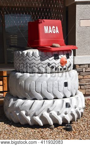 Maricopa, Arizona, March 1, 2021:  The Red Capon The Tire Snowman Representing Make America Great Ag