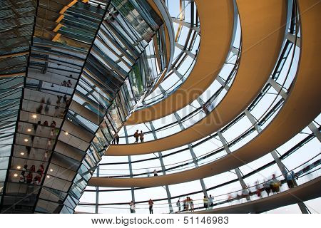 BERLIN, GERMANY - JULY 21, 2013:Tourists inside the glass dome of the Reichstag in Berlin, Germany; July 21, 2013  
