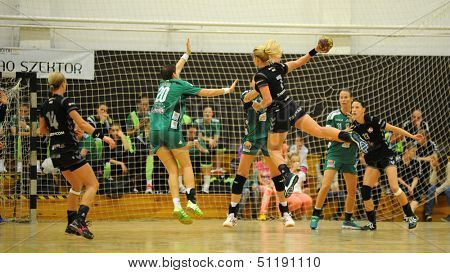 SIOFOK, HUNGARY - SEPTEMBER 14: Unidentified players in action at a Hungarian Championship handball match Siofok KC (black) vs. Gyori Audi ETO KC (green), September 14, 2013 in Siofok, Hungary.