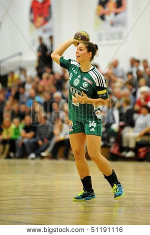 SIOFOK, HUNGARY - SEPTEMBER 14: Aniko Kovacsics in action at a Hungarian National Championship handball match Siofok KC (black) vs. Gyori Audi ETO KC (green), September 14, 2013 in Siofok, Hungary.