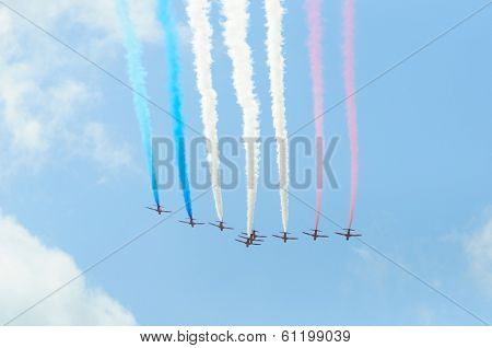 LONDON, UK - CIRCA JUNE 2012: The Red Arrows are doing a flypast over Buckingham Palace.