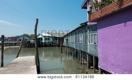PULAU KETAM, MALAYSIA - JANUARY 18, 2015: A view of a fishermen's village on stilts besides the sea in Pulau Ketam (Crab Island). This island is famous for sea food products and restaurants.