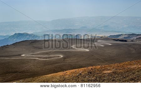 Serpentine road to the top of Mount Etna volcano