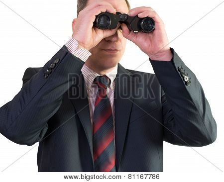 Business man looking through binoculars