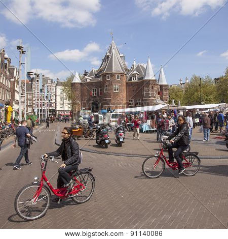 Tourists Ride Rental Bikes On Nieuwmarkt In Amsterdam