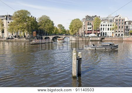Boats On Amstel And Herengracht In Amsterdam