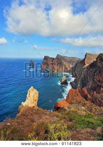 Easternmost tip of the island of Madeira. It is red and orange rocks coolly grow from foamy waves of the Atlantic Ocean