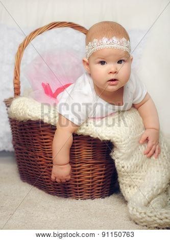 cute little girl try to get out of basket