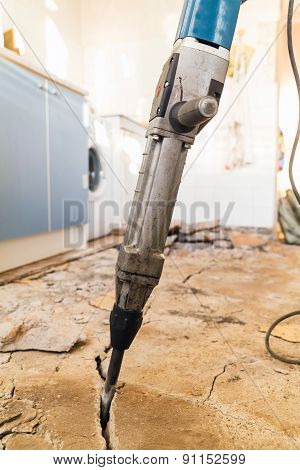 Jackhammer breaking up the concrete floor