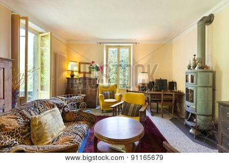 Interiors, nice living room of a rustic home, vintage furniture