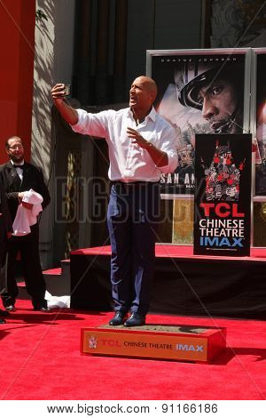 LOS ANGELES - MAY 19:  Dwayne Johnson, The Rock at the Dwayne Johnson Hand and Foot Print Ceremony at the TCL Chinese Theater on May 19, 2015 in Los Angeles, CA