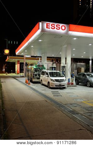 HONG KONG - APRIL 15, 2015: Esso fuel station at evening. Esso is an international trade name for ExxonMobil and its related companies.