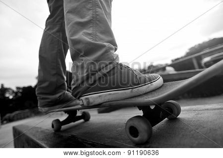 skateboarding legs at skatepark