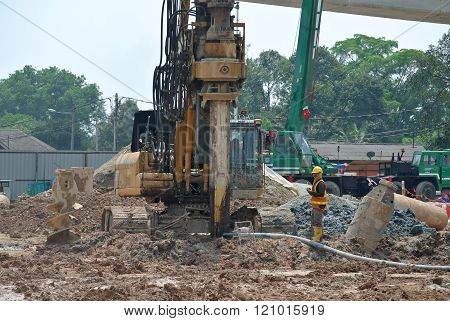 MALACCA, MALAYSIA - FEBRUARY 26, 2015: Bore pile rig machine at the construction site in Malacca, Malaysia. The machine used to driven pile for building foundation work.