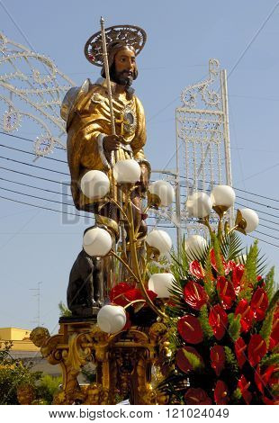 Modugno , Italy - 23 September 2013: statue of the patron saint in a procession with luminarie in the background
** Note: Soft Focus at 100%, best at smaller sizes