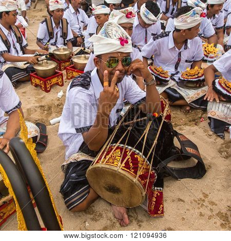SANUR, BALI - MAR 18, 2016: Unidentified local people during performed Melasti Ritual. Melasti is a Hindu Balinese purification ceremony and ritual is held several days prior to the Nyepi holy day.