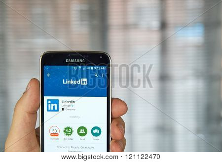 MONTREAL CANADA - MARCH 8 2016 - Linkedin mobile application on screen of Samsung S5 in hand.
