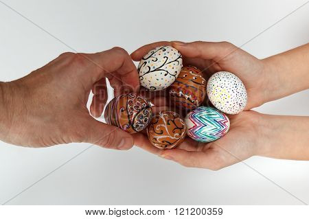 Colorful Easter Eggs On Burlap, Female Hand Chose And Pick One Egg