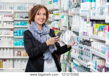 Smiling Customer Scanning Product Through Smart Phone In Pharmac