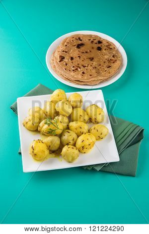 dray potato curry or potato bhaji or aalu bhaji and chapati or roti