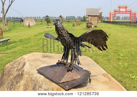 Cock a gold comb. Sculpture made of iron. Tourist Complex Siberian Podvorye.